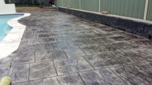 A stamped concrete pool surround in Branxton. Achieve the look of pavers for a lot less money.